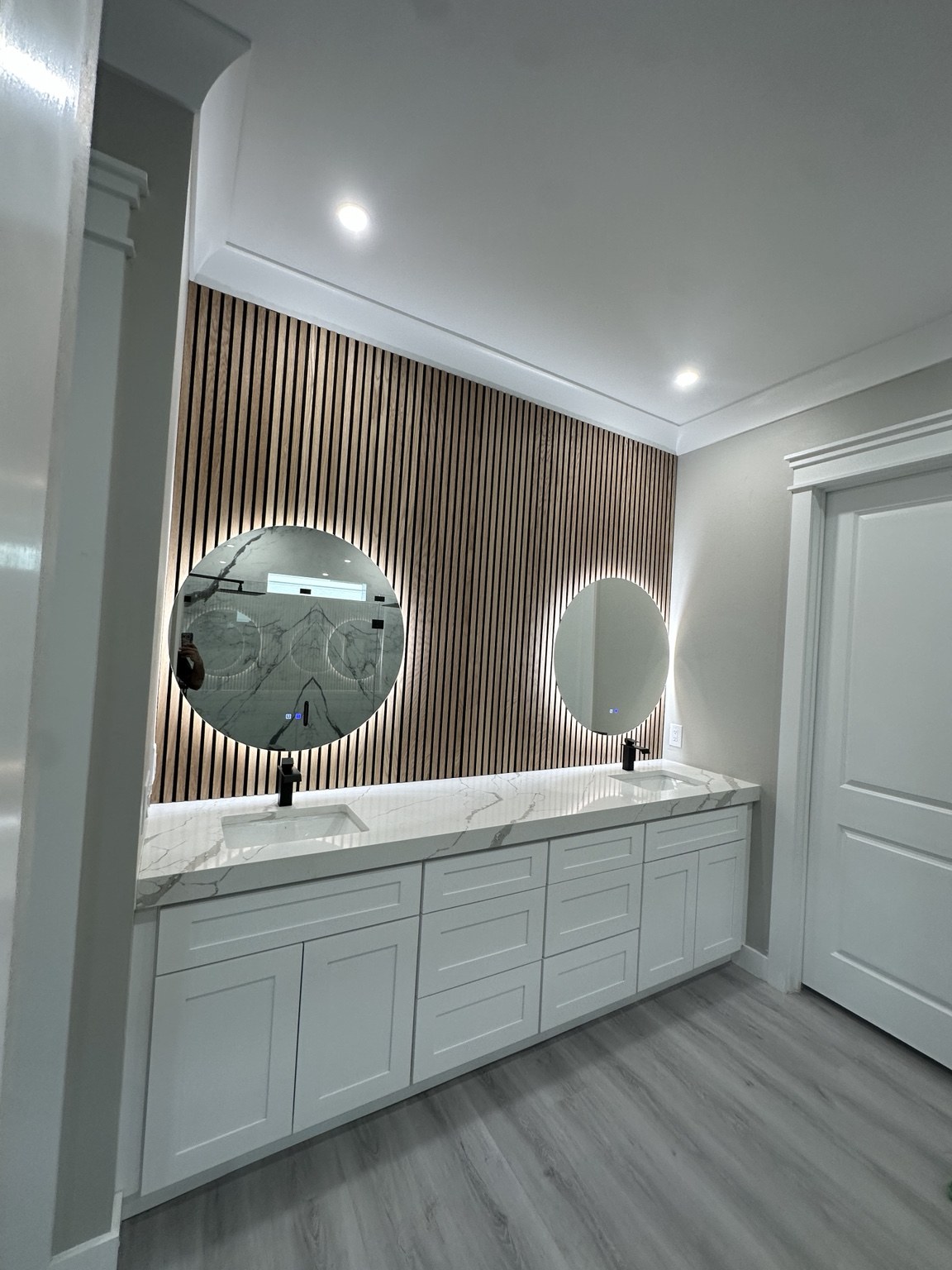 Double vanity and accent wall from an Excellent H Services bathroom project