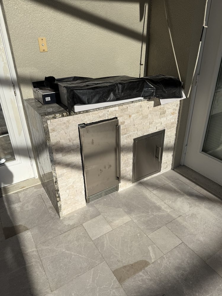 Outdoor kitchen facing and access doors during installation