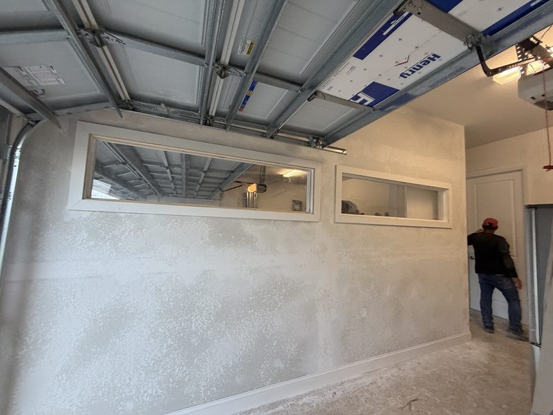 Garage wall and high windows during finishing work