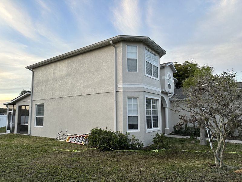 Side exterior walls and two-story window bay