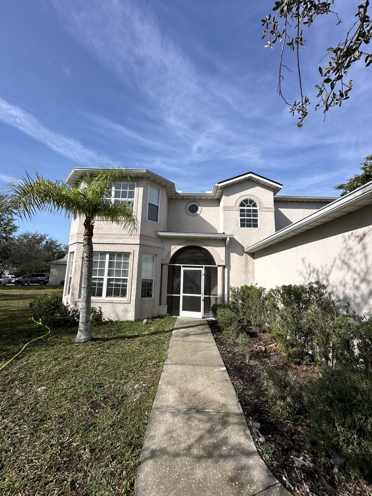 House front entry path and exterior wall finishes