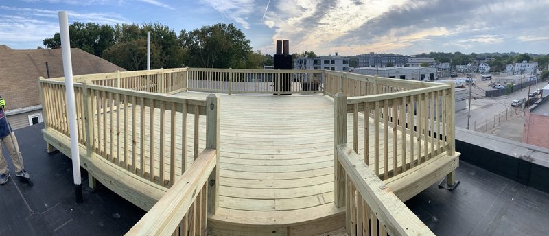 Raised outdoor deck and surrounding railing