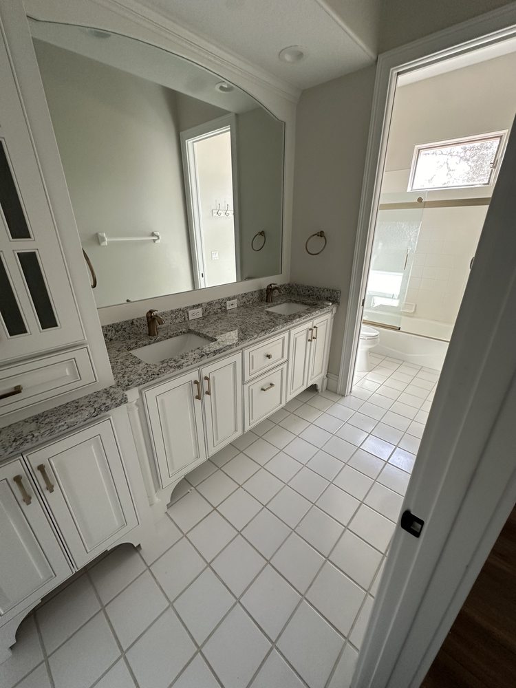 Bathroom cabinetry, countertop and wall mirror