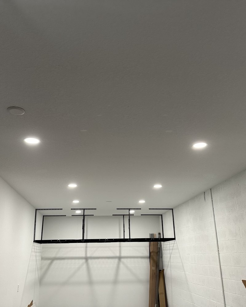 Suspended metal storage rack fixed to the garage ceiling