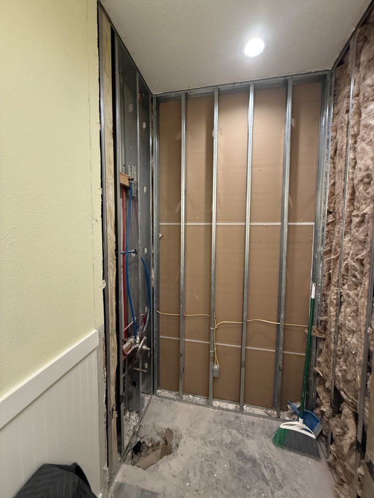 Exposed wall framing during a bathroom remodel