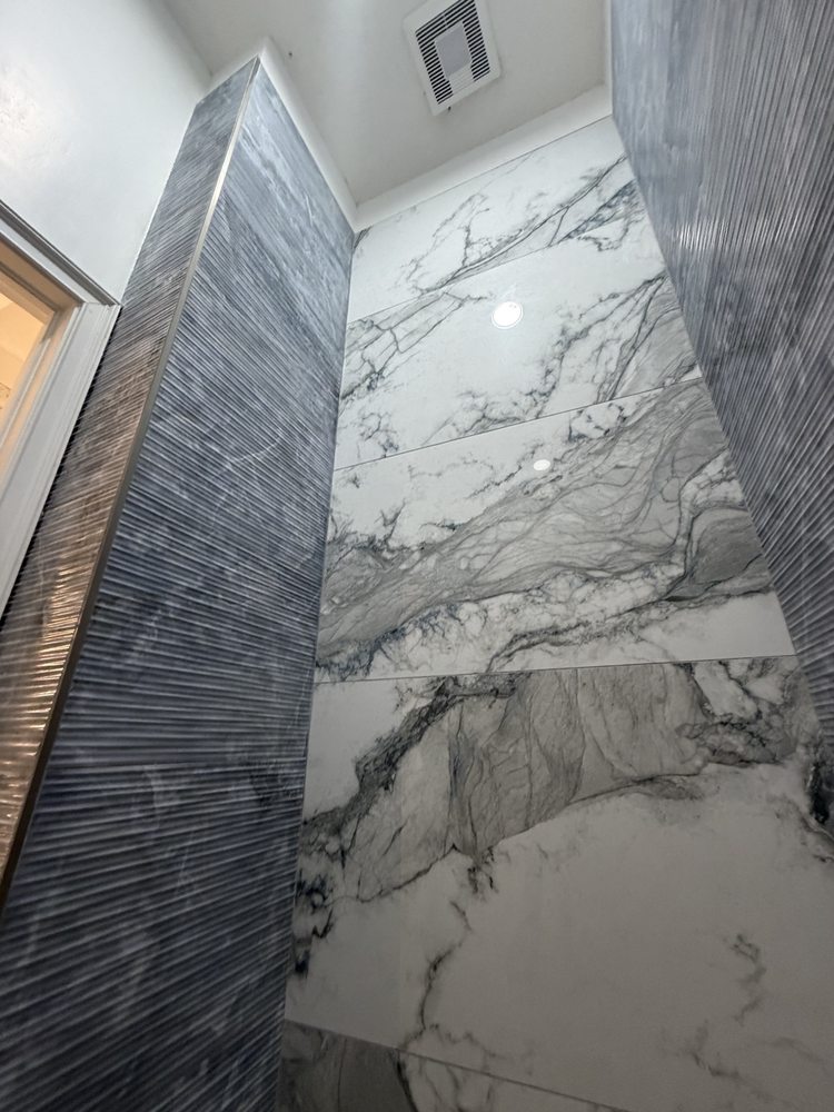 Marble-look and gray textured shower wall tile