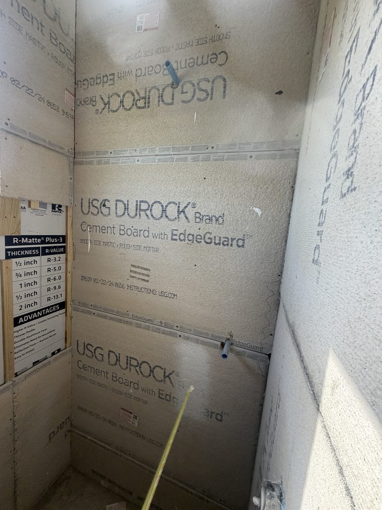 Cement backer boards installed during shower preparation